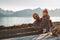 Father traveling with baby in Norway relaxing enjoying mountains view