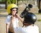 Father trying to wear a bike helmet to his daughter