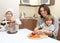 A father with two boys in kitchen