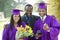 Father with two graduates outside