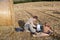 Father and two little boys making evening picnic