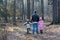 Father Walking With Children In Forest
