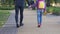 Father walking with daughter to school, holding hand, caring about child safety