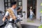 father waving goodbye to his daugther at front house before leaving to the mosque