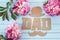 Fathers day background with cardboard letters and purple peonies