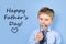 Fathers day concept - boy wears formal shirt and tie just blue background