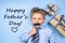 Fathers day concept - boy wears formal shirt and tie just blue background