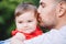 Fathers Day. Middle age Caucasian proud father holding kissing baby daughter. Closeup portrait of dad and daughter together in