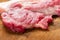 fatty raw pork on chop board