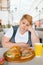 Fatty woman eating pizza in fastfood restaurant