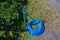 Faucet with blue Hose in garden