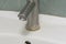 Faucet limescale. Dirty faucet with stain and limescale in bathroom. Selective focus, shallow depth of field