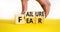 Fear of failure symbol. Businessman turns wooden cubes and changes the concept word Failure to Fear. Beautiful yellow table white