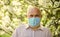 Fear of illness. strategy in battling virus. prohibition on visiting public places. senior man in medical mask. old man