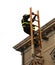 Fearess firefighter over a high wooden staircase during a rescue