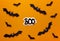 Fearful Halloween background with boo text and black bats