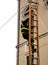 Fearless firefighter over a wooden stairs during a fire-fighting