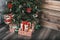 Feast of Christmas. Beautifully decorated Christmas tree with gifts. Nature New Year concept. Add your text