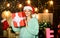 Feast of Christmas. happy new year. Celebrating xmas with family. merry christmas. girl in santa hat present box