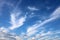 Feathery, wispy white clouds in a blue sky