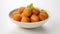 featuring Potato Croquettes elegantly arranged in a white bowl against a pristine white background, the golden brown