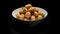 featuring Potato Croquettes elegantly arranged in a white bowl against a pristine white background, the golden brown