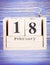 February 18th. Date of 18 February on wooden cube calendar