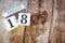 February 18th. Day 18 of February month, white calendar blocks on vintage wooden table background. Winter time. Empty space for