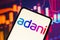 February 2, 2023, Brazil. In this photo illustration, the Adani Group logo is displayed on a smartphone screen
