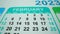 February 2023. Calendar acro shot with many dater. Holidays. A retro flip calendar