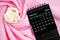 February 2024 desk calendar black color and rose on pink textile