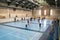 February 21, 2019. Denmark. Copenhagen. Team game with stick and ball Floorball or hockey in hall. Inside training in the gym of