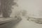 FEBRUARY 24, 2019 - RIDGWAY COLORADO USA - Winter snowy road through deep snow leads to San Juan Mountains leaving tire tread