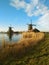 February afternoon almost at sunset time. soft colors and fairy-tale atmosphere surround the traditional windmills typical of zaan