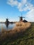 February afternoon almost at sunset time. soft colors and fairy-tale atmosphere surround the traditional windmills typical of zaan