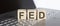 FED abbreviation stands for written on a wooden cube on laptop