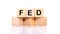 FED, the concept of the Federal Reserve System, a cubic wooden block with the alphabet building the word Fed