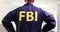 Federal Bureau of Investigation agent in uniform back view 4k movie slow motion