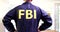 Federal bureau of investigation officer in FBI uniform rear view 4k movie