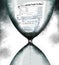 A federal income tax 1040A form is squeezing through an hourglass timer as the tax filing deadline nears