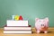 Federal Student Aid theme with textbooks and piggy bank