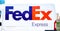 FedEx Express company logo on a delivery van, side view, closeup, nobody. FedEx truck brand symbol, package delivery car, Fedex