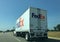 FedEx truck on highway background