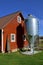 Feed storage tank and old red barn