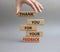 Feedback symbol. Wooden blocks with words Thank you for your Feedback. Beautiful grey background. Businessman hand. Business and