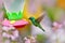 Feeder with hummingbird. Tropic wildlife. Hummingbirds with orange flower. Two green birds Green Violet-ear, Colibri thalassinus,
