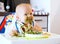 Feeding. Baby\'s first solid food