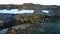 Feeding base of walruses and people on shores of Arctic Ocean aero view.