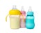 Feeding bottles with milk on white background