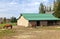 Feeding horses and barn in rural Oregon.